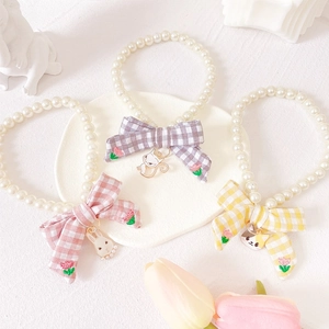 Chic pet pearl collar set with houndstooth bows and cute animal charms for cats and dogs