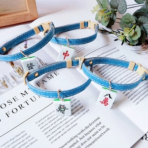 Denim pet collars featuring Mahjong tile pendants including Fa and Zhong characters