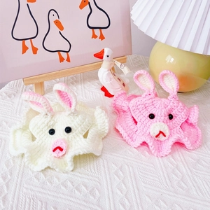 Handmade crochet bunny hats for pets, featuring soft white and pink knit textures
