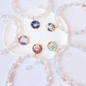 Handmade pet pearl necklace featuring colorful heart stars and cat portrait pendants