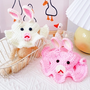 Detailed view of handmade crochet pink and white bunny ear hats for small pets