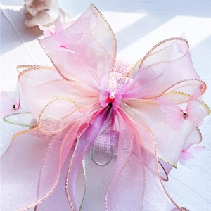 Detail of pink organza bow pet harness with 3D butterflies and metal D-ring for leash