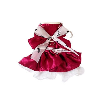 Elegant red satin pet princess dress with a large white bow and pearl chain detail