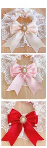 Detailed tile display of pet lace collars with satin bows in beige, pink, and red colors
