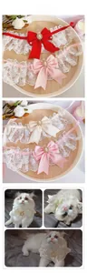 Detailed view of handmade pet lace collars with satin bows and pearl rhinestone charms