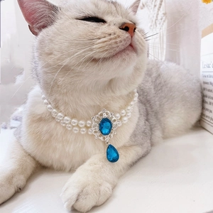 Luxury double-layer pearl pet necklace with a large blue oval gem and teardrop pendant
