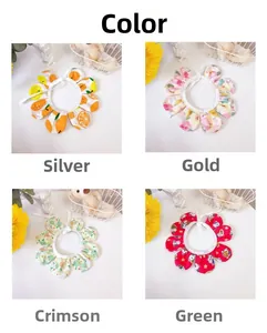 Detail view of four pet floral collars featuring fruit, rose, and lucky cat patterns