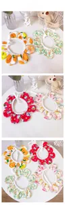 Detail view of four cotton floral petal collars for cats and dogs with tie-on design