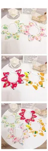 Detailed tile display of four floral patterns on adjustable pet sunflower petal collars