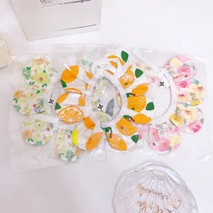 Detailed view of three M-sized sunflower pet collars in individual plastic packaging
