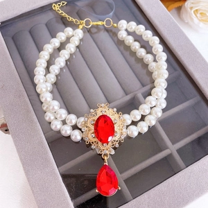 Luxurious double-layer pearl pet necklace with red gemstone and vintage gold pendant