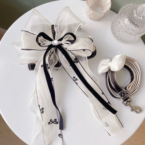 Elegant black and white pet harness set with large organza bow and matching leash