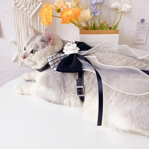 Detail view of adjustable dog harness with camellia flower bow and elegant pearl chains