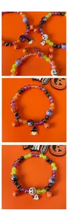 Detail of Halloween pet necklace with purple orange beads and pumpkin ghost charms