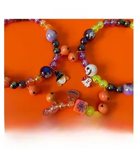 Detailed view of Halloween pet necklace with colorful beads and pumpkin ghost charms