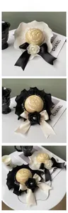 Detail of luxury pet straw hats with camellia flowers and large satin bows for small dogs