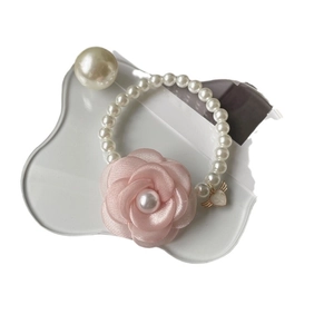 Elegant pet pearl necklace with a large pink camellia flower and a golden heart pendant