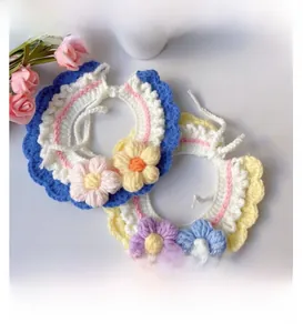 Detailed close-up of handmade crochet pet collars with delicate floral patterns and soft yarn