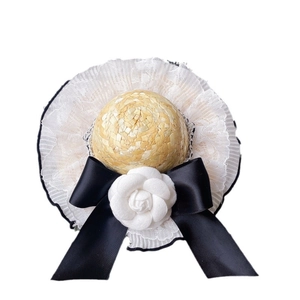 Luxury pet straw sun hat with white lace trim, black ribbon bow and camellia flower