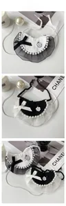 Detail of handmade crochet pet collar with lace, artificial pearls and camellia pendant