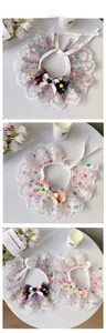 Detail of sweet pet lace collar with polka dot bow and heart gem for small dogs or cats