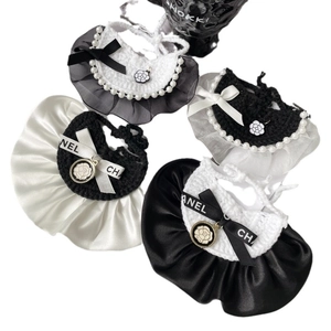 French style knitted pet collars with lace ruffles, pearls, and ribbon bows in black and white
