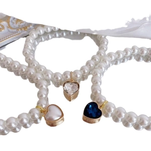 Vintage pearl pet necklace with heart pendants in crystal, white, and blue gemstone charms