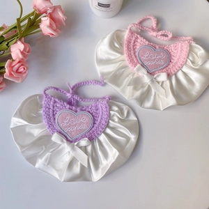 Princess style pet bib with lace trim and heart embroidery in pink and purple tones