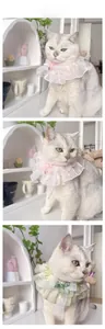 Lace ruffle pet collar with satin bow and crystal heart pendant on a cat