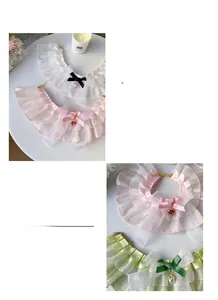 Detailed close-up of lace pet collar with silk bow and heart crystal pendant