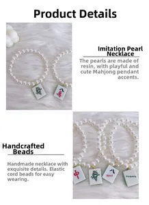 Detail of pet pearl necklace with mahjong pendants and elastic resin bead string
