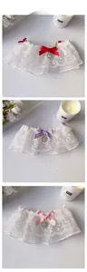 Detailed view of double-layer lace pet collar with a satin bow and heart rhinestone pendant