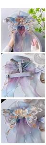 Detail of embroidered butterfly pet harness with gradient mesh and houndstooth webbing