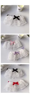 Detail of double-layer lace pet collar with satin bow and heart rhinestone pendant