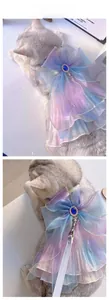 Close-up of mermaid gauze cat harness with large bow, blue gemstone and mesh skirt