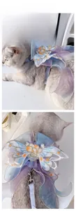 Close-up of embroidered butterfly organza harness and blue plaid leash set for small cats
