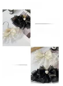 Detail of pet bow collar with double-layer mesh, heart pearl, and rhinestone accents