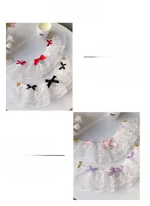 Close-up of double-layer lace pet collar with a 3D ribbon bow and heart rhinestone pendant
