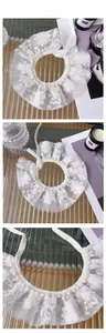 Detail of white lace pet collar with heart embroidery and pearl beads decoration