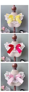 Detailed tile display of floral pet bibs with lace edges and satin heart bows