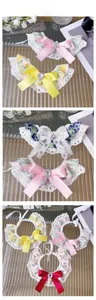 Detail showing lace pet bandana collection with heart rhinestones and floral bow patterns