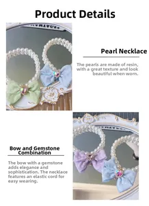 Détail du collier de perles pour animaux avec nœud en tissu et gemme en forme de cœur