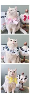 Detail of floral lace pet collars with silk bows and heart-shaped gems for cats