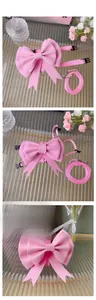 Detailed view of pink bow pet harness and leash set with durable metal D-ring and buckles