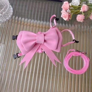 Adjustable pink pet harness and leash set with a sweet bowknot for dogs and cats
