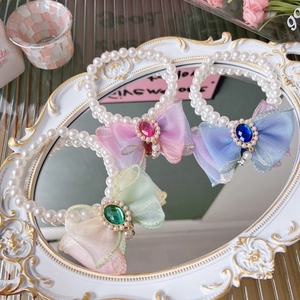 Three-piece pearl pet necklace set with colorful organza bows and gemstone accents