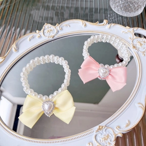 Cute pet pearl necklace with pink and yellow satin bows and heart rhinestone charms