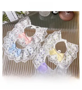 Detail of pet floral lace collars with bows in pink blue yellow and purple colors