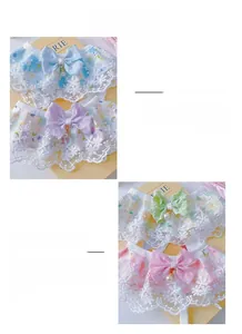 Macro shot of lace pet collars with floral patterns, bows, and elegant pearl pendants
