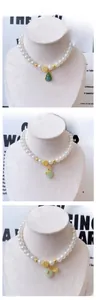 Detail of Chinese style pet pearl necklace with green jade pendants and Fu character charms